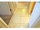 Clean hallway with light beige tile floors at 1999 Kings Hwy # 23C, Punta Gorda, FL 33980