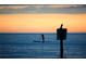 Paddleboarder silhouetted at sunset at 1999 Kings Hwy # 23C, Punta Gorda, FL 33980