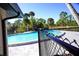 Community pool with fence and landscaping at 1999 Kings Hwy # 23C, Punta Gorda, FL 33980