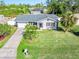 Aerial view of a charming house with a well-maintained lawn at 20430 Dial Ave, Port Charlotte, FL 33952