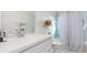 Clean bathroom with tub shower combo and white vanity at 20430 Dial Ave, Port Charlotte, FL 33952