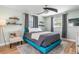 Bright bedroom with a teal bed frame and gray bedding at 20430 Dial Ave, Port Charlotte, FL 33952