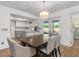 Dining room with a chandelier and view into the kitchen at 20430 Dial Ave, Port Charlotte, FL 33952