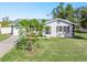 House exterior with driveway and manicured lawn at 20430 Dial Ave, Port Charlotte, FL 33952