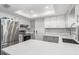 Modern kitchen with stainless steel appliances and white cabinets at 20430 Dial Ave, Port Charlotte, FL 33952