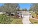 Single story home with attached garage and landscaping at 21190 Midway Blvd, Port Charlotte, FL 33952