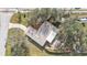 Aerial view of a single-story house with a large yard and lanai at 21190 Midway Blvd, Port Charlotte, FL 33952