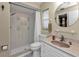 Clean bathroom with a walk-in shower and pink vanity at 21190 Midway Blvd, Port Charlotte, FL 33952