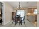 Charming dining room with wooden table and chairs, kitchen view at 21190 Midway Blvd, Port Charlotte, FL 33952