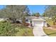 Single story home with attached garage and landscaped yard at 21190 Midway Blvd, Port Charlotte, FL 33952