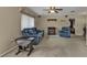 Living room featuring a blue sofa, recliner, and fireplace at 21190 Midway Blvd, Port Charlotte, FL 33952