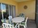 Private patio with table and chairs, ideal for outdoor dining at 2180 Heron Lake Dr # K-208, Punta Gorda, FL 33983