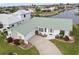 Aerial view of the house showing the metal roof and landscaping at 2218 Cassino Ct, Punta Gorda, FL 33950