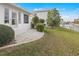 Backyard patio with canal access and lush landscaping at 2218 Cassino Ct, Punta Gorda, FL 33950