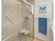 Bathroom with walk-in shower and grab bars at 2218 Cassino Ct, Punta Gorda, FL 33950