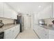 Spacious kitchen with white cabinets and granite countertops at 2218 Cassino Ct, Punta Gorda, FL 33950