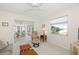 Living room with comfortable seating, large window, and view of the lanai at 2218 Cassino Ct, Punta Gorda, FL 33950