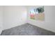 Unfinished bedroom with concrete floors and a window at 230 Waterway Ne Cir, Port Charlotte, FL 33952