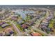 Aerial view of a beautiful community with a lake at 2408 Silver Palm Rd, North Port, FL 34288