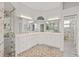 Elegant bathroom with double vanity and marble flooring at 2408 Silver Palm Rd, North Port, FL 34288