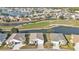 Aerial view of community with houses and lake at 24356 Westgate Blvd, Punta Gorda, FL 33980