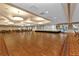 Large ballroom with hardwood floors, perfect for events at 24356 Westgate Blvd, Punta Gorda, FL 33980