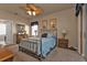 Bedroom with metal bed frame and ceiling fan at 24424 Buckingham Way, Punta Gorda, FL 33980