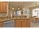 Granite countertop kitchen with breakfast bar and stainless steel appliances at 24424 Buckingham Way, Punta Gorda, FL 33980