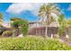 Landscaped backyard with wooden fence and arbor at 25188 Marion Ave # 34, Punta Gorda, FL 33950