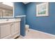 Bathroom features a toilet, vanity, and a framed piece of art at 25188 Marion Ave # 34, Punta Gorda, FL 33950