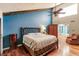 Main bedroom with a king-size bed, wood floors, and a walk-in closet at 25188 Marion Ave # 34, Punta Gorda, FL 33950