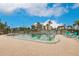 Community pool area with surrounding building in background at 25188 Marion Ave # 34, Punta Gorda, FL 33950