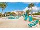 Community pool with lounge chairs and a great view at 25188 Marion Ave # 34, Punta Gorda, FL 33950