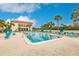 Community pool with plenty of lounge chairs at 25188 Marion Ave # 34, Punta Gorda, FL 33950