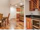 View of a wet bar with wine rack and mini-refrigerator, connecting to the dining area at 25188 Marion Ave # 34, Punta Gorda, FL 33950