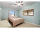 Comfortable bedroom with a queen bed, dresser, and ceiling fan at 2544 Warne St, Port Charlotte, FL 33952