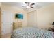 Bedroom with a double bed, dresser, and large TV at 2544 Warne St, Port Charlotte, FL 33952