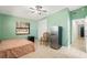 Bedroom with a double bed, mini fridge, and ceiling fan at 2544 Warne St, Port Charlotte, FL 33952