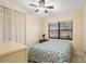 Bright bedroom with double bed, window, and built-in closet at 2544 Warne St, Port Charlotte, FL 33952