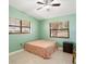 Bedroom with a floral bedspread and ceiling fan at 2544 Warne St, Port Charlotte, FL 33952