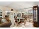 Dining area with glass-top table and mirrored accent wall at 2544 Warne St, Port Charlotte, FL 33952