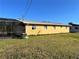 House exterior showcasing a side view and a well-maintained lawn at 2727 Poinciana Ct, Punta Gorda, FL 33950