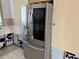 Stainless steel refrigerator in renovated kitchen at 2727 Poinciana Ct, Punta Gorda, FL 33950