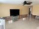 Living room with new tile floor and wall damage at 2727 Poinciana Ct, Punta Gorda, FL 33950