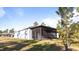 View of the back of the house with a large screened patio at 2784 Dode Ave, North Port, FL 34288