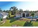 Single-story home with landscaped yard and two-car garage at 2812 Cabaret St, Port Charlotte, FL 33948