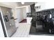 Kitchen features stainless steel refrigerator and granite countertops at 2812 Cabaret St, Port Charlotte, FL 33948