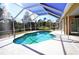 Enjoy this refreshing pool with screened patio cover at 2812 Cabaret St, Port Charlotte, FL 33948