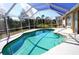 Inviting kidney-shaped pool with screened enclosure at 2812 Cabaret St, Port Charlotte, FL 33948