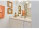 Bathroom with single vanity, mirror, and shower/tub combo at 2970 Cascabel Ter, North Port, FL 34286